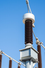 Porcelain insulators in high voltage electrical substation.