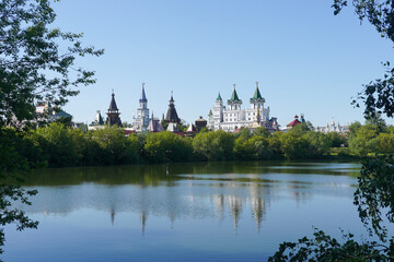 Fototapeta na wymiar Izmailovo Kremlin on the lake shore in summer, Moscow, Russia