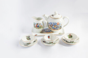 Vintage porcelain coffee set with cartoon scenes