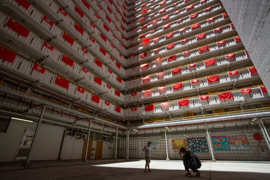flags for celebrate the 25th anniversary of the establishment of the Hong Kong Special Administrative in Ping Shek Estate, Hong Kong - Powered by Adobe