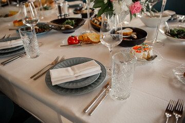 serving plate with cutlery on the table in the restaurant