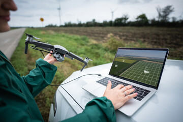 Farmer with laptop and drone on the field. Smart farming and agriculture digitalization	 - obrazy, fototapety, plakaty