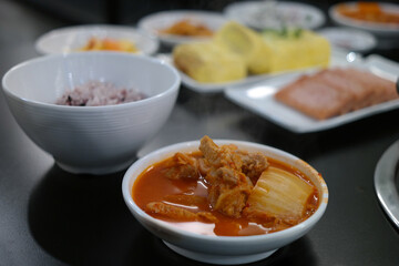 Over-fermented kimchi boiled with pork, bean curd, and green onion. Often considered Korean “soul food,” this spicy kimchi stew strikes a perfect balance with the greasy pork.