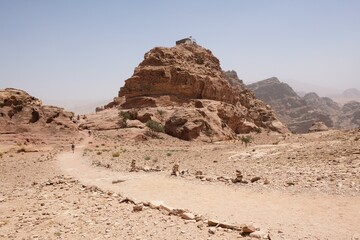 Wonderful mountain views with silhouettes of hiking people on the Jordan Trail from Little Petra (Siq al-Barid) to Petra. Jordan, Hashemite Kingdom of Jordan 