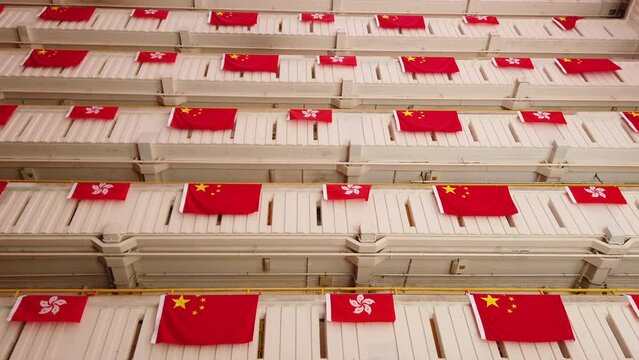 flags for celebrate the 25th anniversary of the establishment of the Hong Kong Special Administrative in Ping Shek Estate, Hong Kong