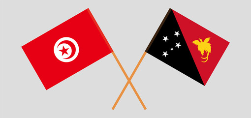 Crossed flags of Tunisia and Papua New Guinea. Official colors. Correct proportion