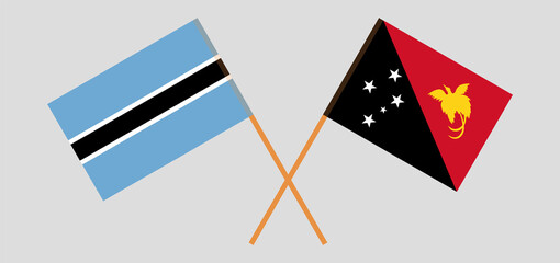 Crossed flags of Botswana and Papua New Guinea. Official colors. Correct proportion