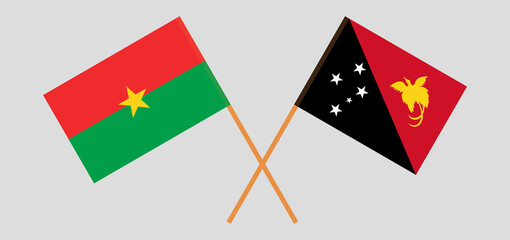 Crossed flags of Burkina Faso and Papua New Guinea. Official colors. Correct proportion