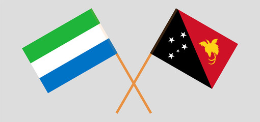 Crossed flags of Sierra Leone and Papua New Guinea. Official colors. Correct proportion