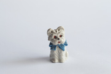 Vintage porcelain figurine - small dog with blue ribbon