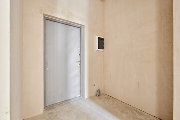 Interior of new apartment without finishing in gray tones