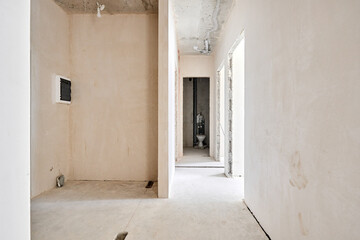 Interior of new apartment without finishing in gray tones