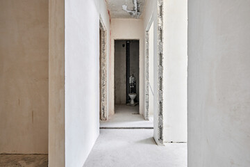 Fototapeta na wymiar Interior of new apartment without finishing in gray tones