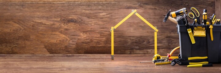 House Made Of Measuring Tape With Tools Box