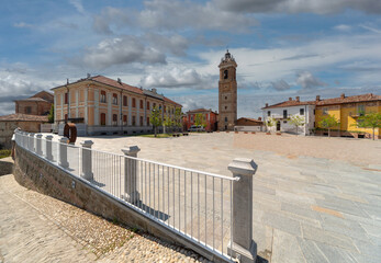 La Morra, Langhe, Italy- May 02, 2022: Piazza Castello with the bell tower and the school building...