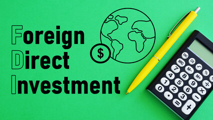 Foreign Direct Investment FDI is shown using the text - obrazy, fototapety, plakaty