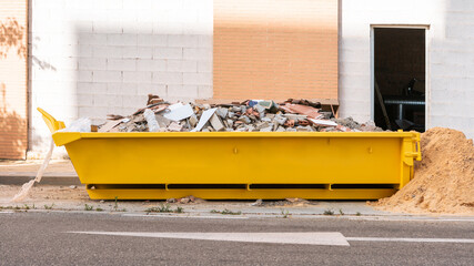 Loaded dumpster with space to display your logo design, mockup for advertisement