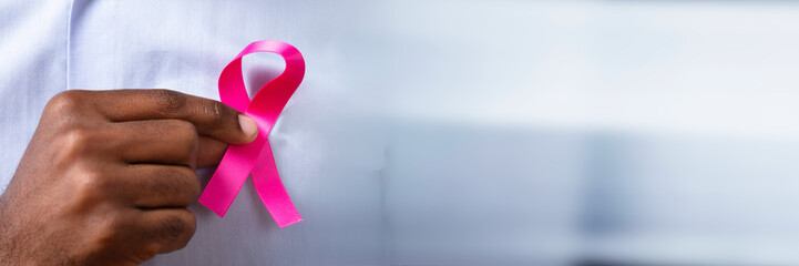 Close-up Of A Man's Hand With Pink Ribbon