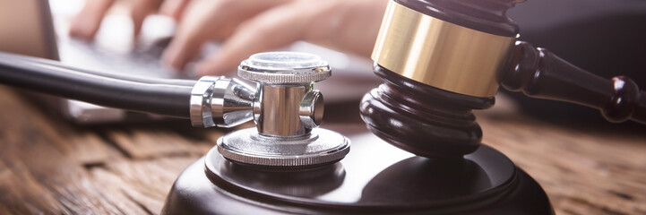 Close-up Of Stethoscope And Gavel