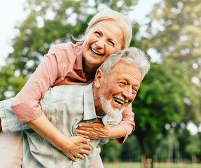 woman man outdoor senior couple happy lifestyle retirement together smiling love fun elderly active...
