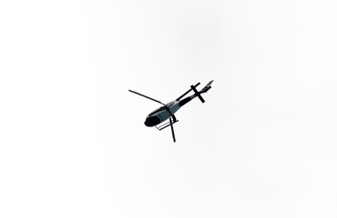 Helicopter Flying in the sky on a white background for design as a security concept and surveillance