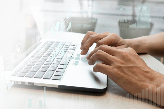 Businessman hand working with laptop computer with technology digital graphic