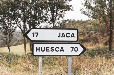 traffic signpost pointing the way to Jaca and Huesca, province of Huesca, Aragon, Spain