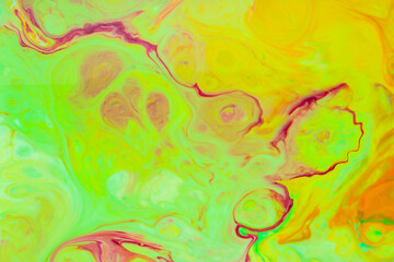 Abstract green-orange fluid art background. Backdrop with abstract mixing paint effect. Liquid surface with blurry paint spots