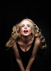 Pretty glamorous blonde fashion model woman with wind in the hair portrait