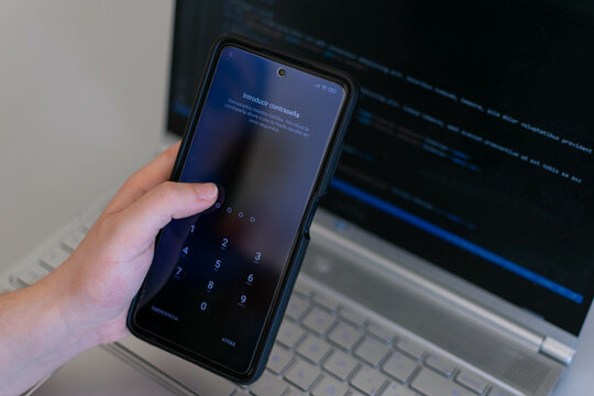 Phishing, mobile phone hacker or cyber scam concept. Password and login pass code in smartphone. Online security threat and fraud. Female scammer with cellphone and laptop. Bank account security.