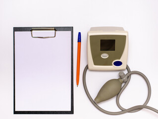 Recording a prescription by a doctor after measuring the patient's blood pressure copy space