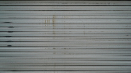 Old and scratched iron shutter door texture