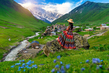 Tourist enjoy view of Ushguli village in Georgia.