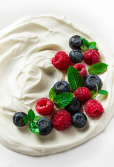 Breakfast, yogurt with fresh berries, raspberries and blueberries, on a white background, selective focus, no people, healthy food,