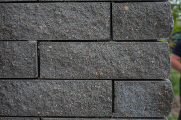 Wall texture and gray block pattern are suitable for a simple design background.