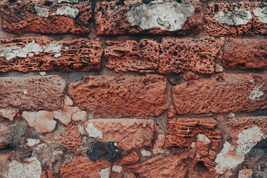 Ancient Brick Red Wall. A Wall of old, cracked bricks or stones, with a Weathered Surface. © Valeriia Zub