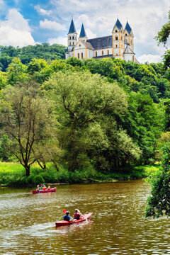 Obernhof at the Lahn with Kloster Arnstein on the hill . Beautyful landscape with river and boats in the Lahn valley on a sunny day in summer.