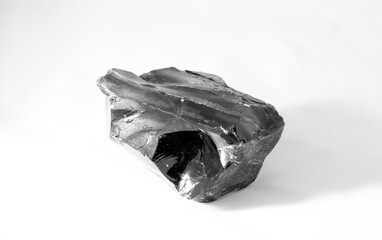 obsidian stone, volcanic glass natural stone on white background.