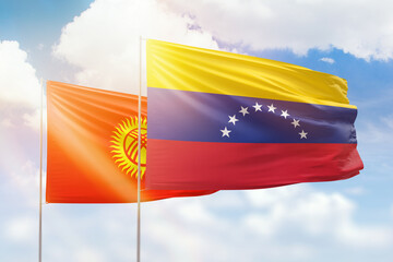 Sunny blue sky and flags of venezuela and kyrgyzstan