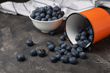 Blueberry. Ripe and fresh blueberries on a black textured background. Vitamins. Healthy food. Juicy berry. Copy space. Place for text