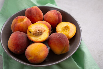 Close up of ripe organic peach in bowl fruits