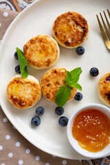 Overhead view of pancalkes with jam and berries breakfast