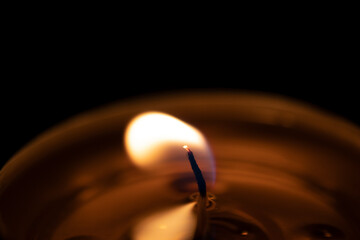 close-up candle flame, black background