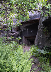 Kalvoysund, Norway - May 27, 2022: Kalvoysund fortress was a German coastal battery composed of some 50 shelters and casemates as well as four 105mm guns. Selective focus.