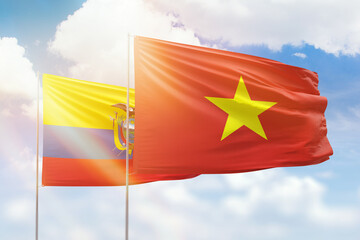 Sunny blue sky and flags of vietnam and ecuador