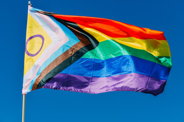 Progress LGBTQ progress rainbow flag waving in the wind