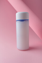 Cosmetics bottle mock up on pink background, blank label, no brand mock up. Cream refiner, shampoo, foam container for face skin care