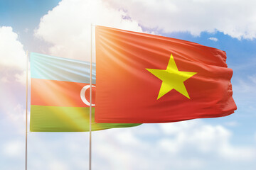 Sunny blue sky and flags of vietnam and azerbaijan