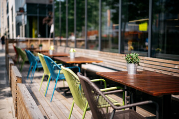Flowers on a wooden table in a outdoor restaurant