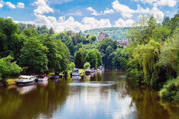  Nassau on der Lahn. View to the riverbank of the river Lahn with boats and beautiful landscape, Germany